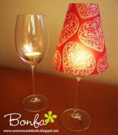 Cheap wine glass + tea light candle + paper cup with bottom cut out:) THAT'S REALLY SMART!!