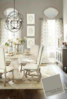 Benjamin Moore Galveston Gray dining room with pedestal table and white upholstered chairs
