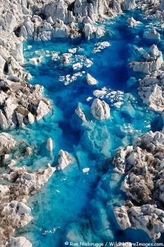 Aerial view of blue meltwater pools on Columbia Glacier, Prince William Sound,  Chugach National Forest, Alaska