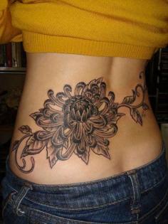 chrysanthemum lower back tattoo 