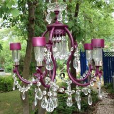 Solar powered chandelier.  Replace light bulbs with dollar store solar lights.