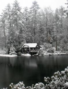 Mountain log #cabin rental with a waterwheel in snow at High Hampton Inn in Cashiers NC. Find a cabin at www.romanticashev...