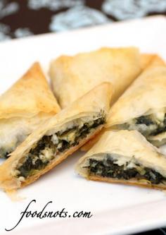 Spanakopita Triangles... must make them! I have all of the ingredients in my fridge except for the phyllo dough!