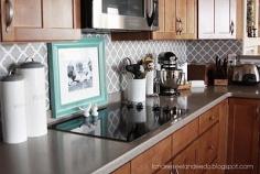 Vinyl quatrefoil backsplash.  Couldn't be easier and made a huge impact on the space!