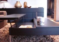 coffee table with pull up trays easy for working on the laptop in the living room so its not always on your lap.