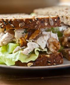 10 Things to Do With a Rotisserie Chicken: Chicken Salad Sandwich with chicken, halved green grapes, toasted walnuts, mayonnaise, crème fraîche, Dijon mustard, fresh lemon juice, and chopped fresh tarragon