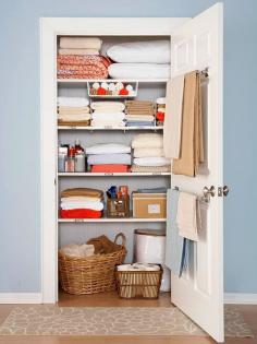 Use a towel rod on the inside of the linen closet for holding blankets. (this is a good idea for back of guest room door too so if guests need extra blankets, they are easy to find)