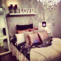 Great bedroom. Love those gold decorative pillows!