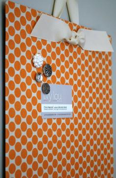Cover a flat cookie sheet (at the dollar store!) with fabric and get an instant magnet board.