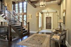 Home entryway with staircase off to the side.