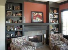 fireplace with built in bookshelves | These dark built-in shelves around this fireplace provide the perfect ...