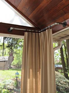 Savvy Southern Style: My Favorite Room.....The Painted Home (clever idea for hanging curtains in the corner of a porch!)