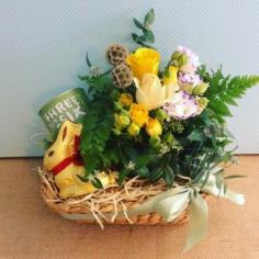 Easter Gift Hamper contains a small ceramic pot arrangement of flowers, a Lindt Chocolate Bunny and a Threeonesix tinof tea, packaged in a s...