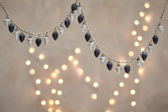 A bauble garland is a festive and vibrant decoration, perfect for adding a touch of sparkle to any holiday setting. Whether draped over a mantle, hung on a tree, or used to adorn windows, it combines classic ornaments with a modern twist, creating a cheerful atmosphere. Ideal for creating memorable moments during the holiday season.